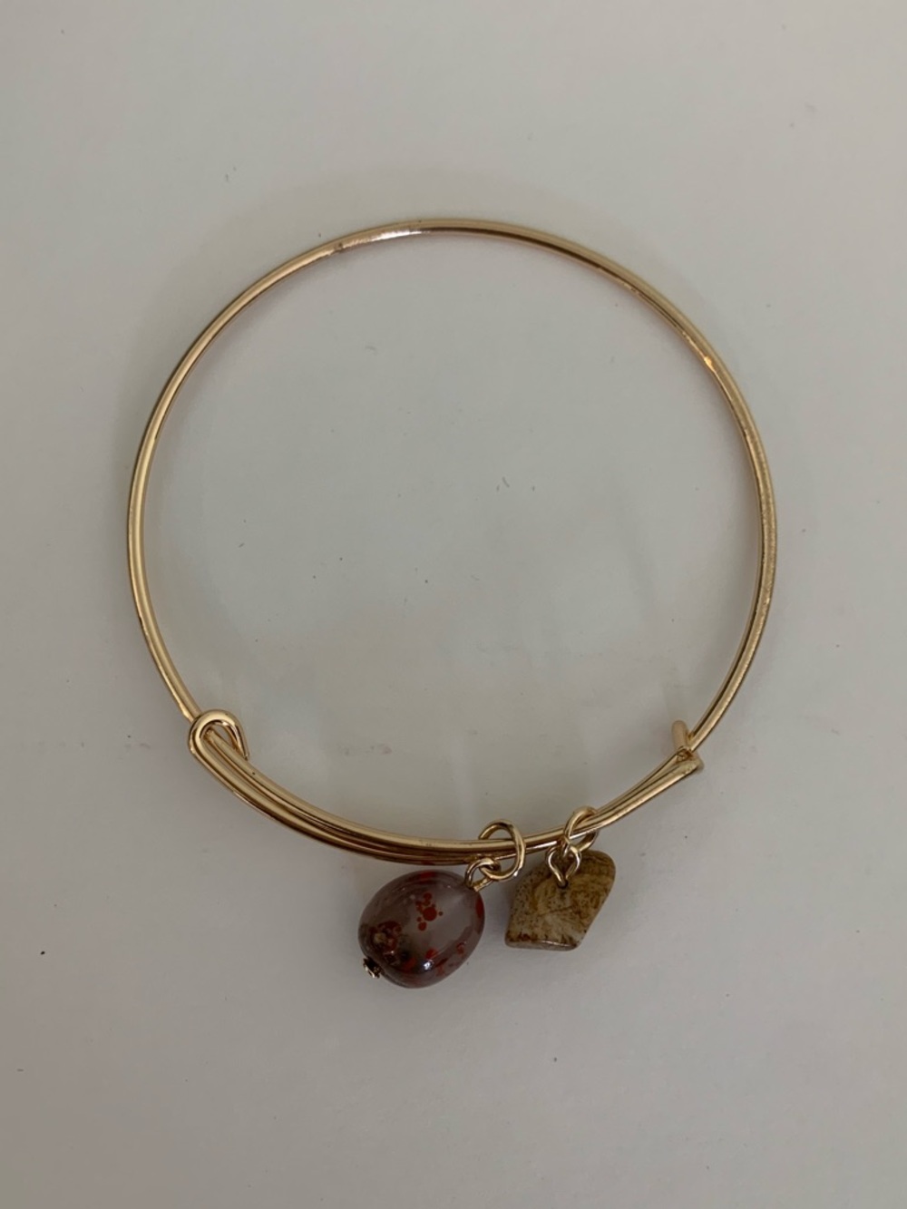 Gold-Tone Bangle Bracelet with Brown and Tan Stone Charms